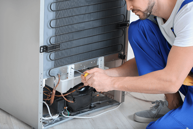 Refrigerator door hinge alignment service in Dubai - SRB Dubai technician adjusting misaligned doors