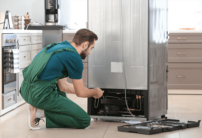 Emergency refrigerator repair service in Dubai - SRB Dubai technician performing diagnostic tests