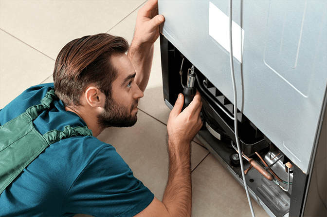 Refrigerator fan motor replacement in Dubai - SRB Dubai installing new evaporator fan in a Sharp fridge
